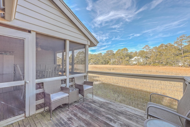 wooden terrace with a sunroom