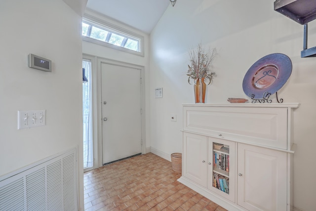 entryway with high vaulted ceiling