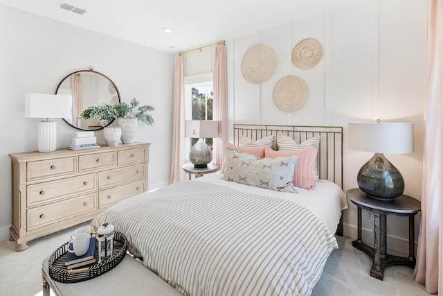 bedroom featuring visible vents and carpet flooring