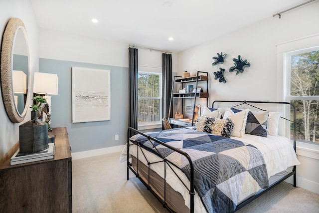 bedroom with recessed lighting, baseboards, and light colored carpet