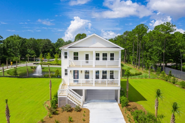 view of front facade with a porch, a balcony, a garage, stairs, and driveway