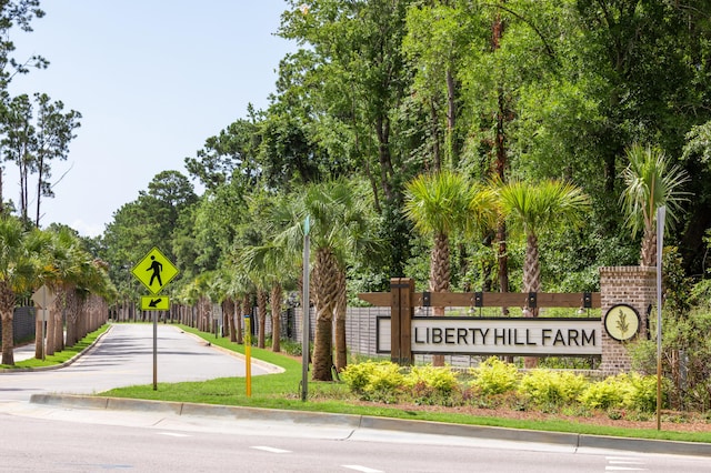 community sign featuring fence