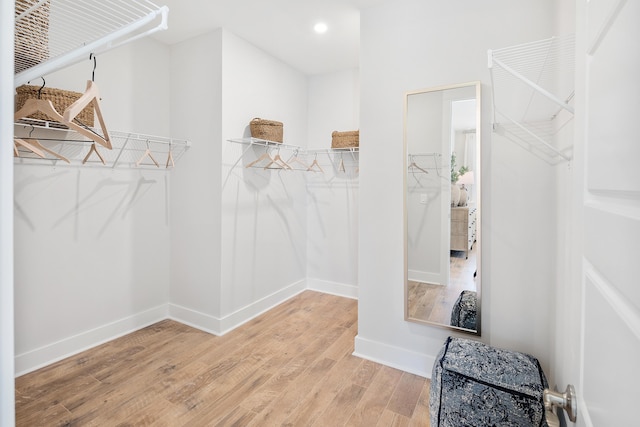 spacious closet with wood finished floors