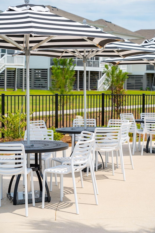 view of patio / terrace featuring outdoor dining space and fence