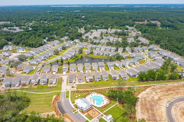 aerial view with a water view, a residential view, and a wooded view