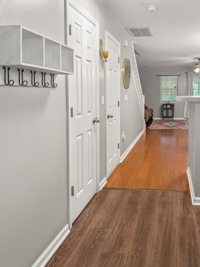 hallway featuring dark hardwood / wood-style flooring