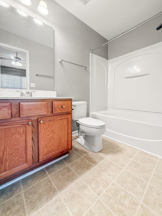 full bathroom with vanity, shower / bath combination, tile patterned flooring, toilet, and ceiling fan