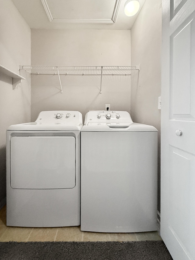 clothes washing area featuring washing machine and clothes dryer