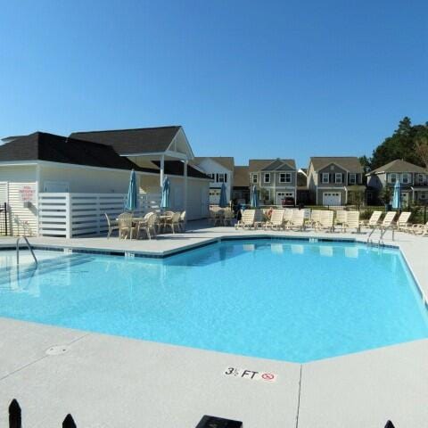 view of swimming pool featuring a patio area