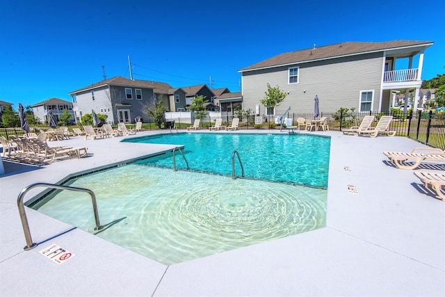 view of swimming pool with a patio area