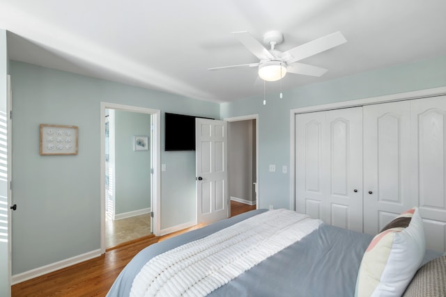 bedroom featuring dark hardwood / wood-style flooring and ceiling fan