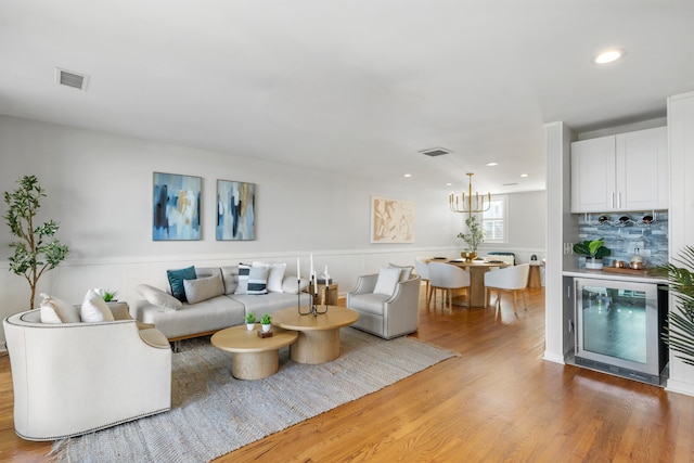 living room with hardwood / wood-style flooring and indoor bar