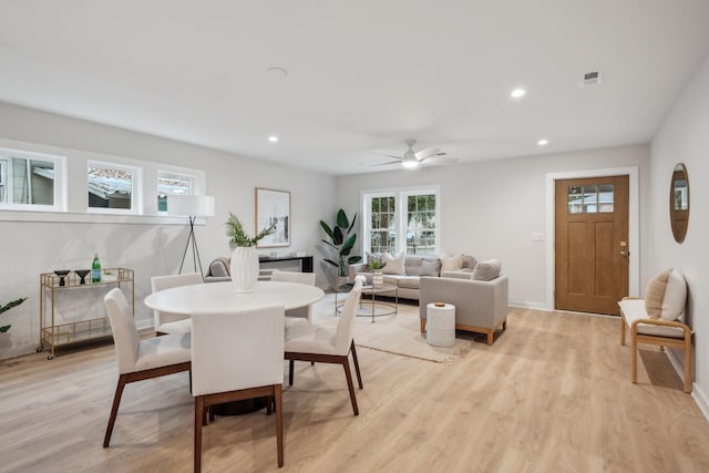 dining room featuring ceiling fan and light hardwood / wood-style flooring