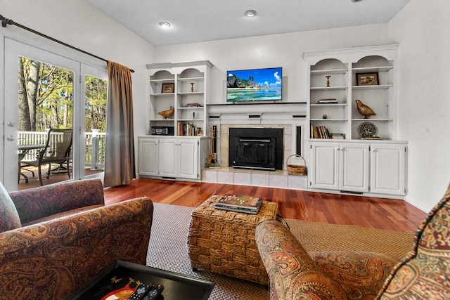 living area featuring a fireplace and wood finished floors