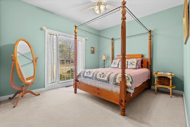 bedroom with baseboards, ceiling fan, and carpet flooring