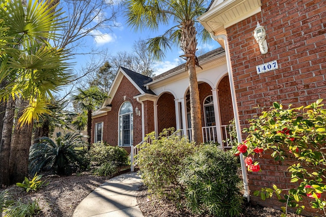 exterior space featuring brick siding