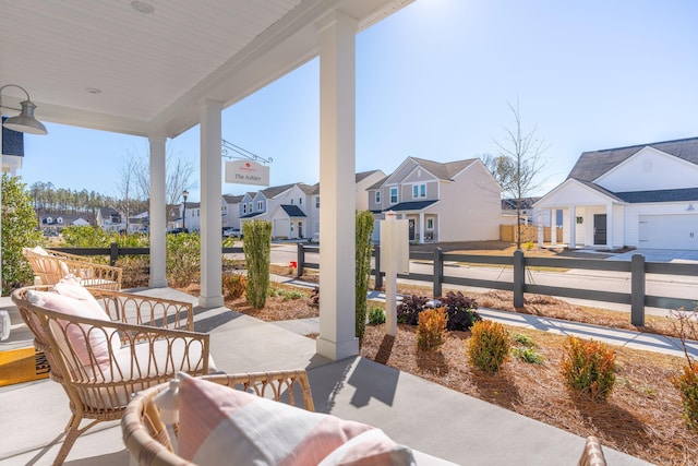 view of patio / terrace featuring a residential view and covered porch