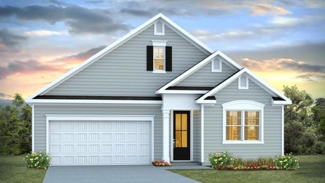 view of front facade with a lawn and a garage