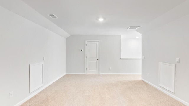 bonus room featuring light colored carpet and lofted ceiling