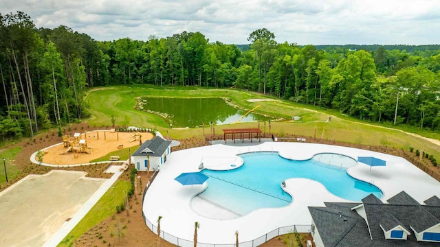 view of pool featuring a water view