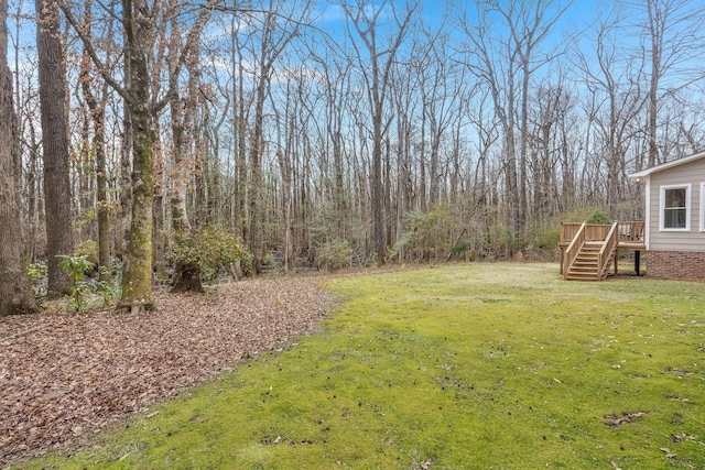 view of yard featuring a wooden deck