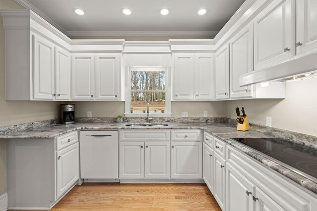 kitchen with sink, white appliances, white cabinetry, and light hardwood / wood-style flooring