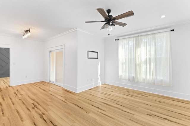 spare room with crown molding, ceiling fan, and light hardwood / wood-style floors