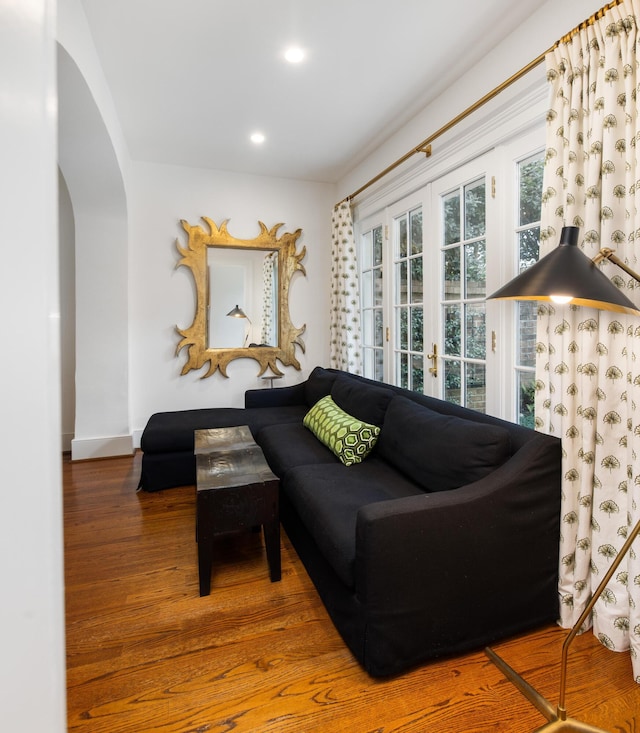 living room with hardwood / wood-style flooring and french doors