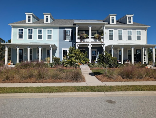 view of front of home featuring a balcony