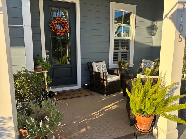 property entrance with covered porch