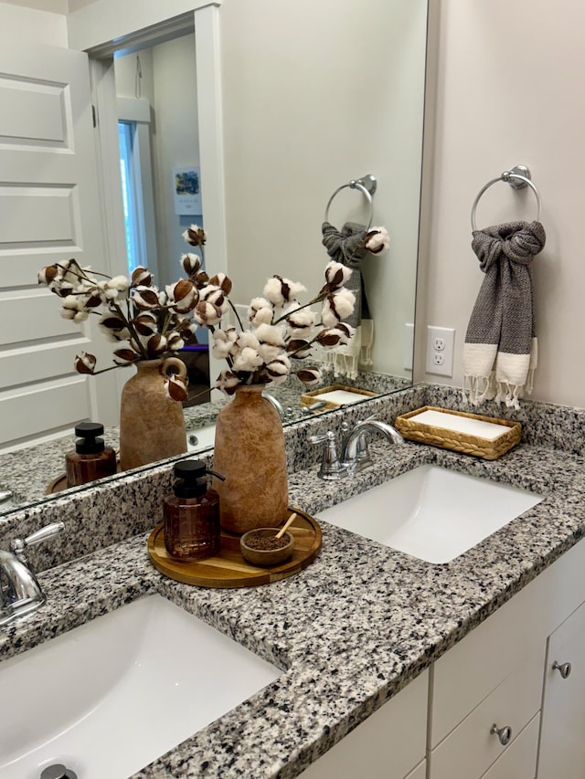 room details featuring a sink and double vanity