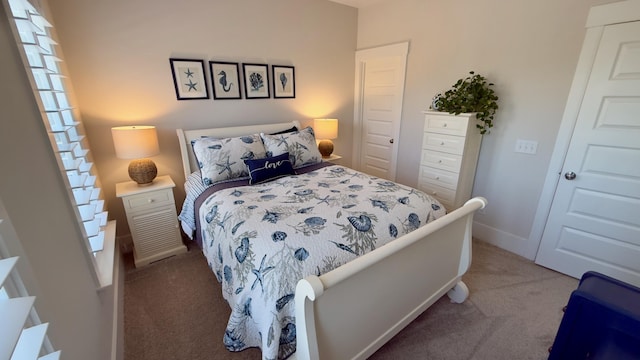 bedroom featuring baseboards and carpet floors