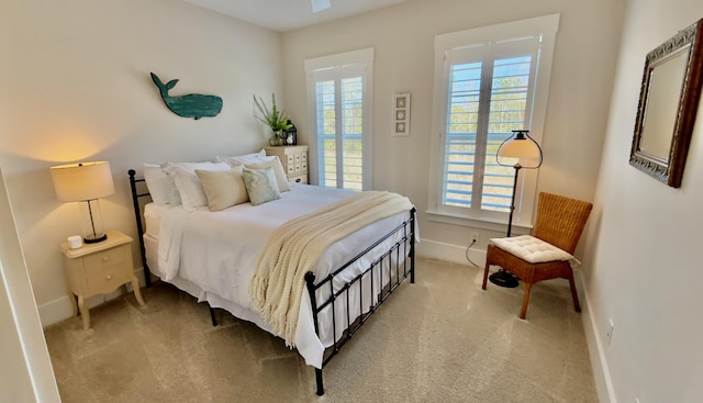 carpeted bedroom featuring baseboards