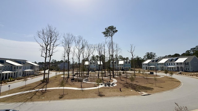 exterior space with curbs and a residential view