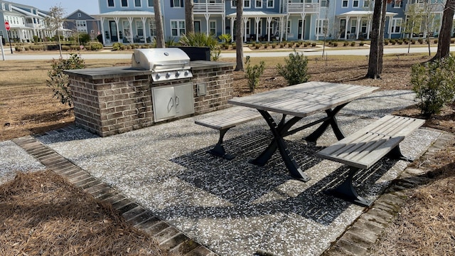 view of community featuring exterior kitchen and a residential view