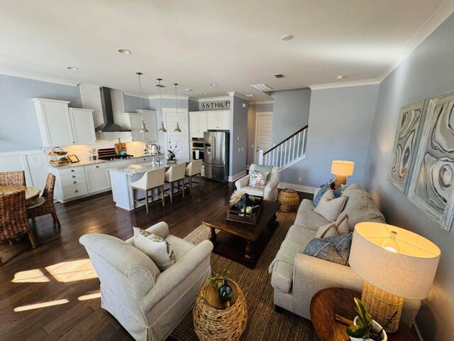 living room with visible vents, stairs, ornamental molding, recessed lighting, and dark wood-style floors