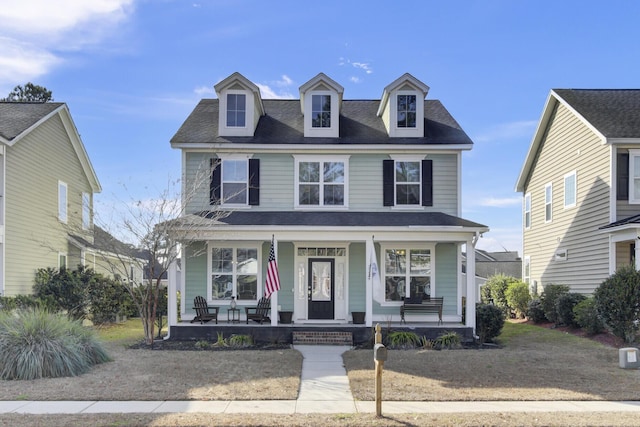 view of front of property with a front lawn and covered porch