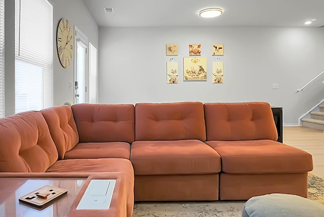 living area with visible vents and stairway