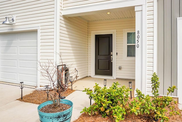 property entrance with a garage