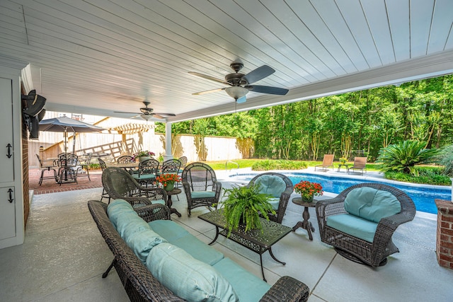 69 King Charles Cir, Summerville, SC 29485 - fenced backyard with outdoor dining area, an outdoor hangout area, ceiling fan, and a patio