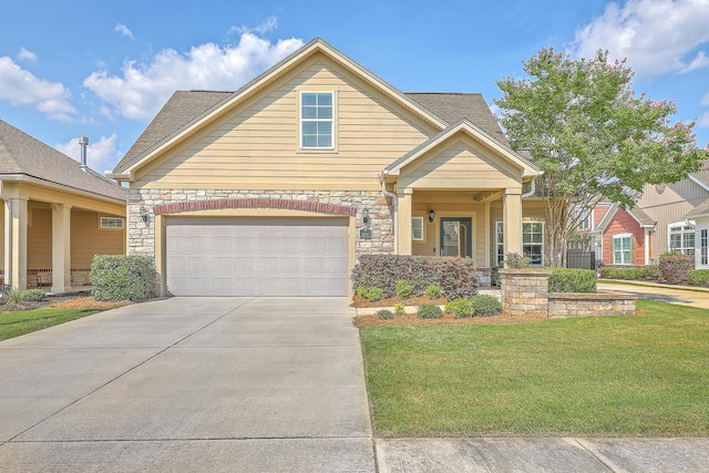 271 Village Stone Cir, Summerville, SC 29486 - view of front of house with a front lawn, a garage, driveway, and stone siding