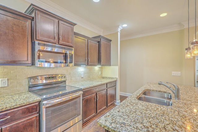 271 Village Stone Cir, Summerville, SC 29486 - kitchen with stainless steel appliances, ornamental molding, light stone countertops, decorative backsplash, and recessed lighting