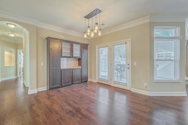 271 Village Stone Cir, Summerville, SC 29486 - unfurnished dining area with dark wood-type flooring, arched walkways, plenty of natural light, and crown molding