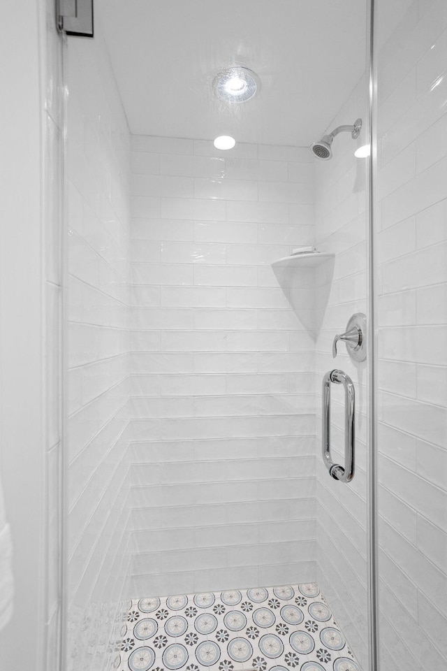 bathroom with a shower with shower door