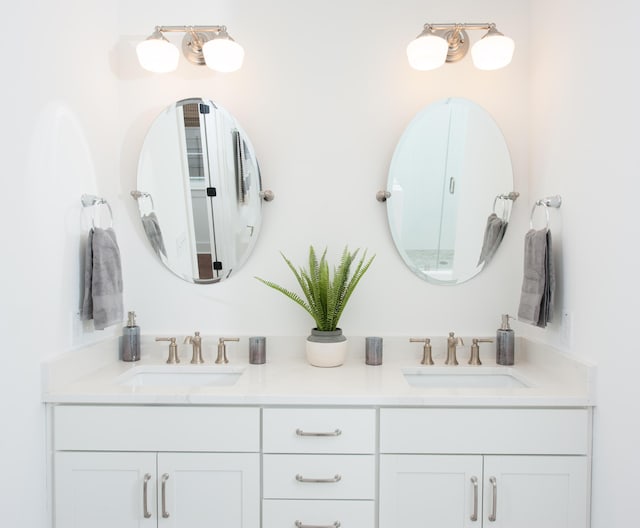 bathroom with double vanity and a sink