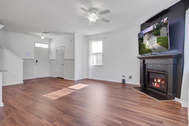 596 Wayton Cir, Moncks Corner, SC 29461 - unfurnished living room featuring a fireplace with flush hearth, wood finished floors, ceiling fan, and baseboards