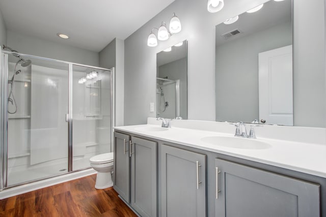 596 Wayton Cir, Moncks Corner, SC 29461 - bathroom featuring a shower with door, toilet, and double vanity