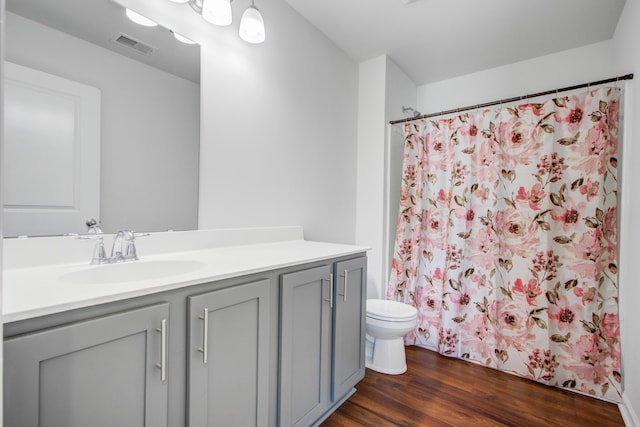 596 Wayton Cir, Moncks Corner, SC 29461 - bathroom featuring toilet, vanity, wood finished floors, and curtained shower