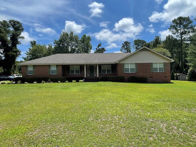 ranch-style home with a front lawn