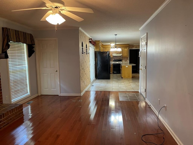 interior space featuring crown molding, ceiling fan, and light hardwood / wood-style floors